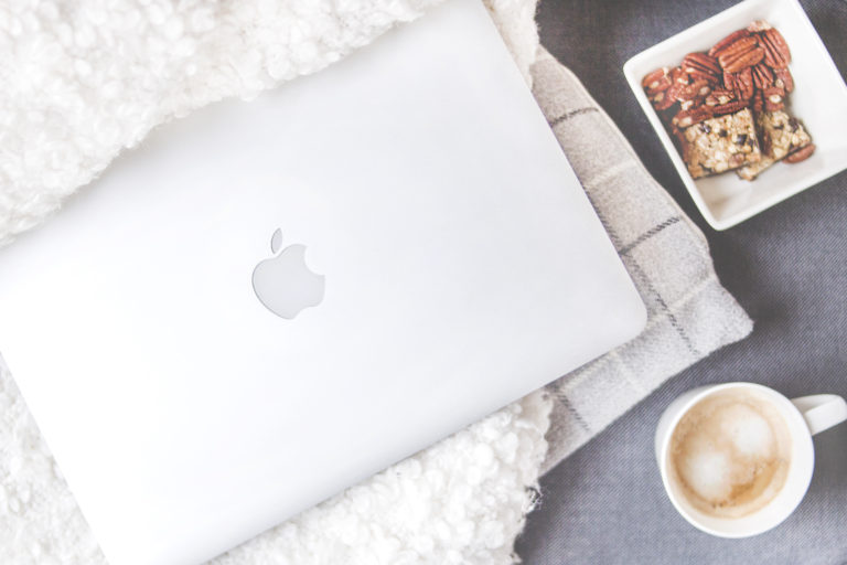 https://www.istockphoto.com/photo/top-view-of-workspace-with-laptop-cup-of-coffee-and-copy-space-on-colored-background-gm1047639930-280228339