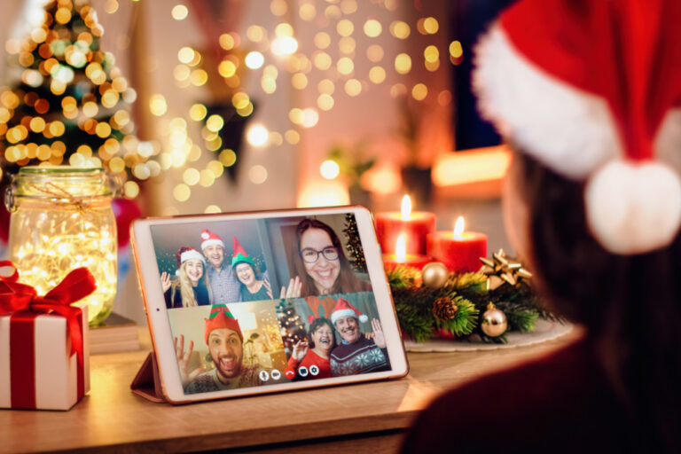 Christmas Eve etiquette | photo of ipad with zoom or facetime call, family members and friends wearing Christmas attire