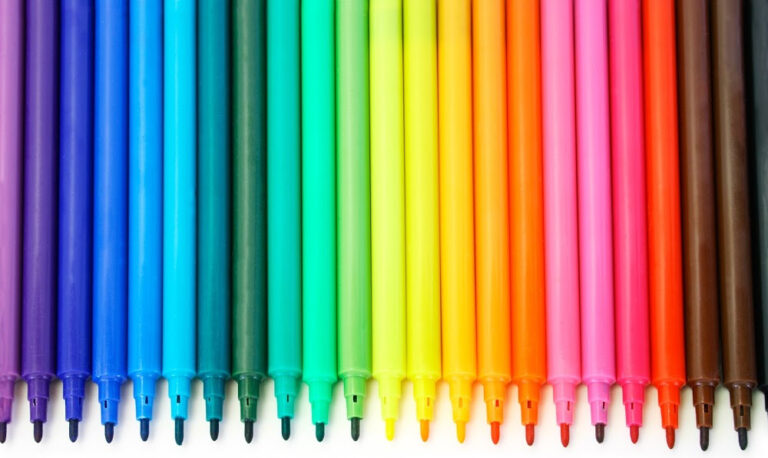 goals for the new year | overhead photo of magic markers lined up in a range of colors