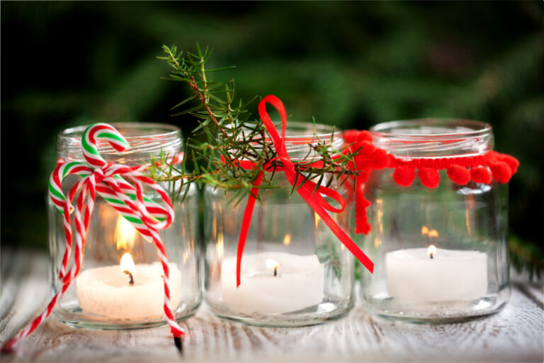 reduce holiday stress | three mason jars decorated for the season with candles