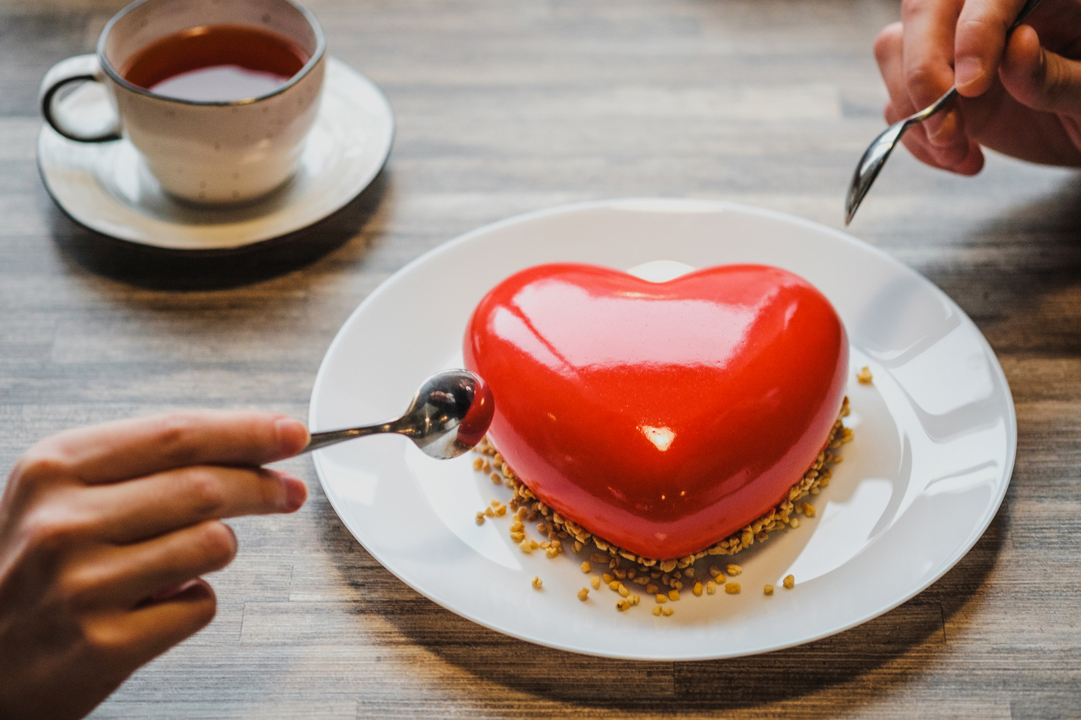 thoughtful gestures | couple sharing heart shaped cake