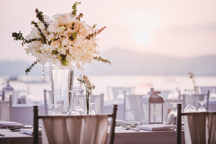 summer wedding etiquette | Table setting at a luxury wedding and Beautiful flowers on the table.