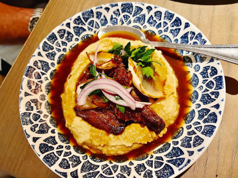 when to send food back at a restaurant | plate of Mexican food in a blue and white dish with fresh herbs and broth