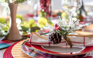 holiday party etiquette | Closeup of festive Christmas table setting for holiday entertaining