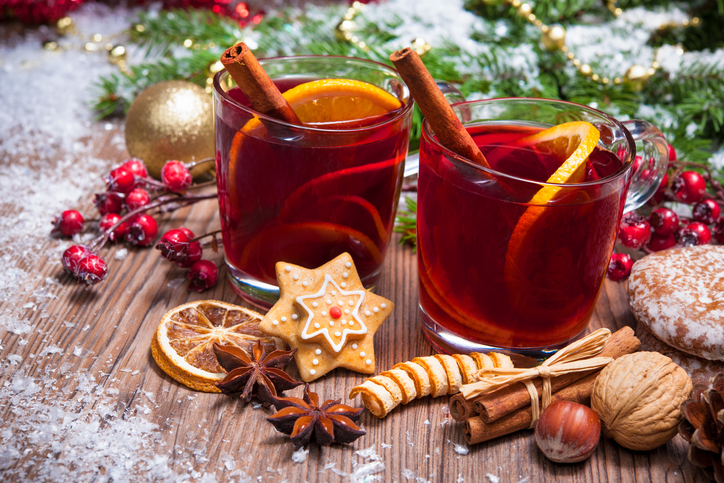 Christmas Tea thoughts from etiquette expert Diane Gottsman | Two glasses of mulled wine with christmas decoration