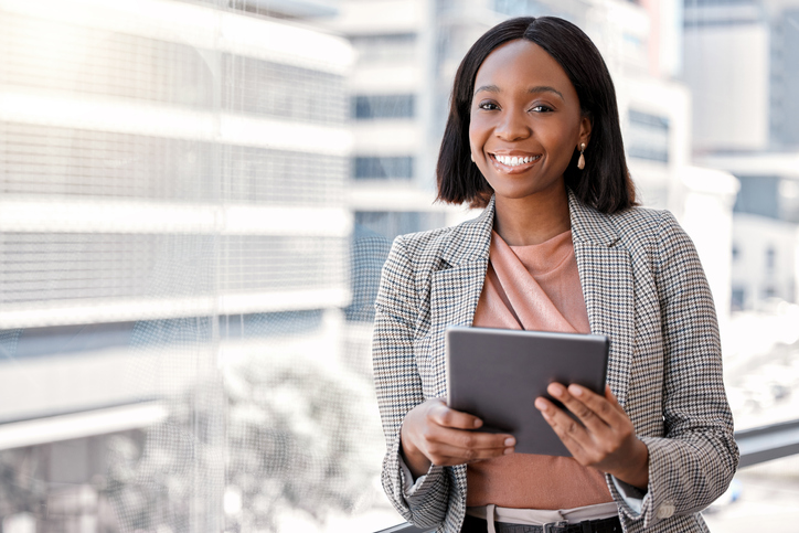 Shot of a young businesswoman using a digital tablet in her office