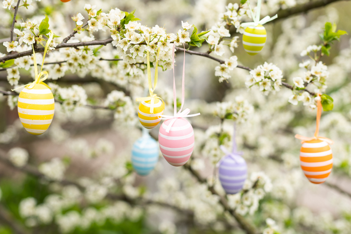 Easter tips and traditions | Easter decorative composition with painted eggs, flowering branches