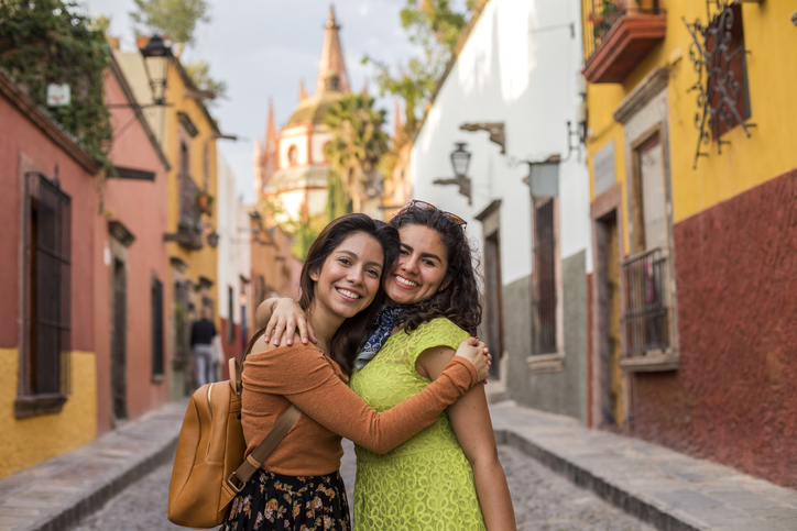 Friends taking a selfie at a viewpoint in San Miguel de Allende, Mexico