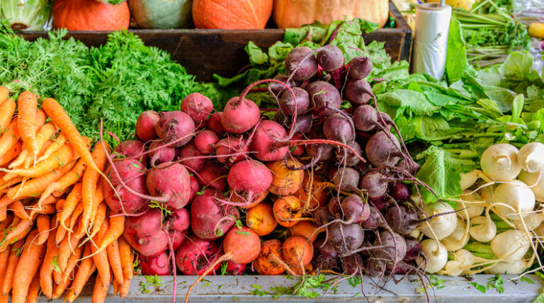 Farmers Market Tipping Etiquette | A fruit and vegetable stall with produce on display