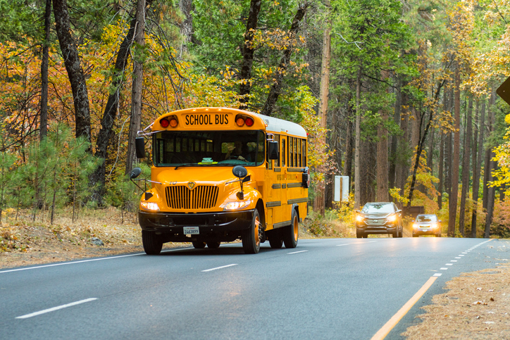 Yosemite, California, USA - October 25, 2018: School bus on Northside drive in Yosemite National Park, California, USA