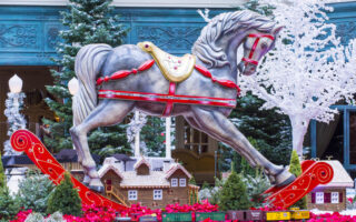 hotel etiquette holidays 2023 | Las Vegas , USA - November 30, 2012: Winter season in Bellagio Hotel Conservatory & Botanical Gardens