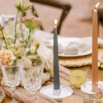 table set with candles and flowers to celebrate | how to politely split a birthday bill among friends