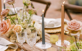 table set with candles and flowers to celebrate | how to politely split a birthday bill among friends