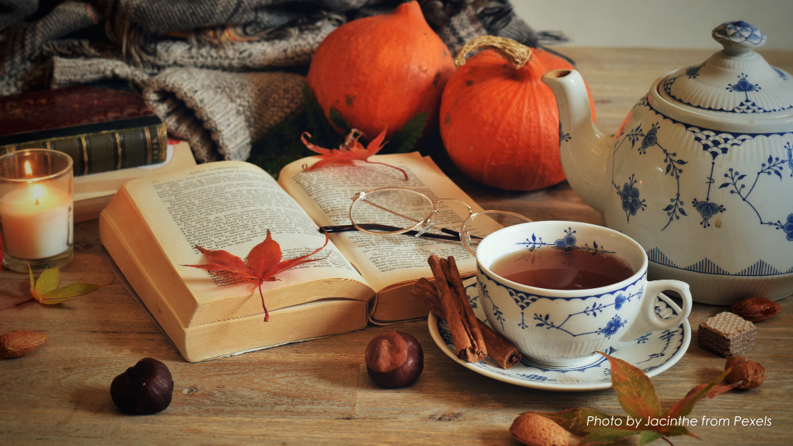 Fall tea scene with pumpkins and blue and white teacups