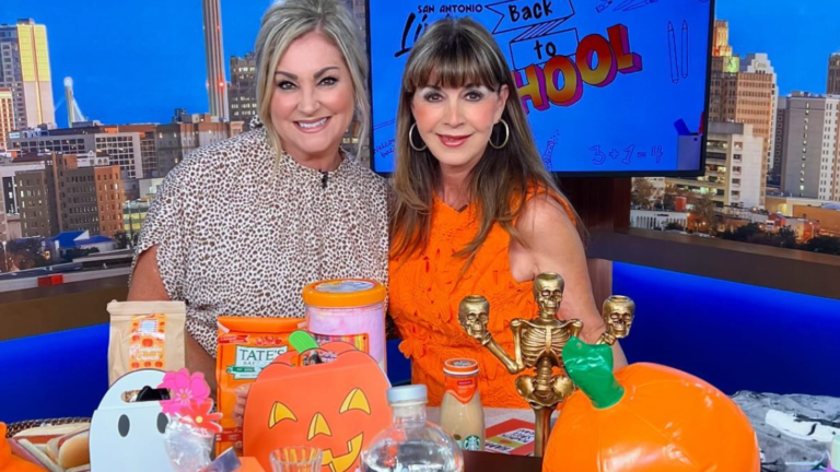 Summerween Party Tips from Etiquette Expert Diane Gottsman | Diane Gottsman and Shelly Miles on the set of San Antonio Living posing behind a table of Summerween party essentials in bright orange and fall colors
