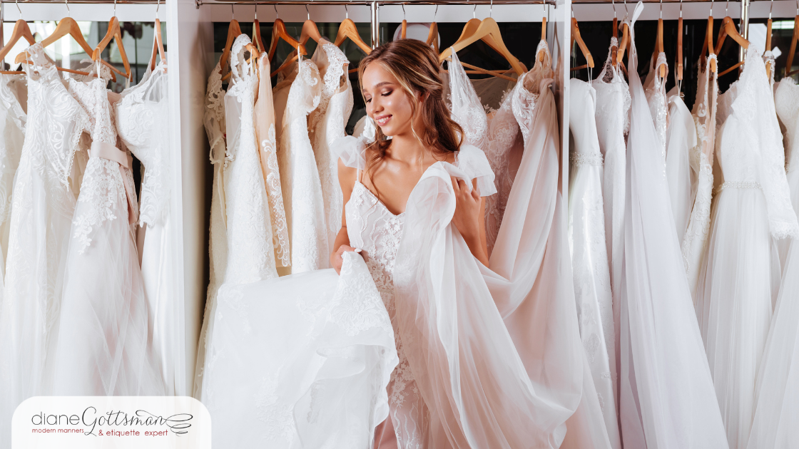 etiquette for canceling a wedding | bride-to-be trying on wedding gowns in a bridal shop