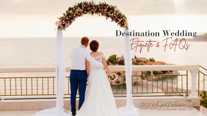 Destination Wedding Etiquette & FAQs | Couple at beach wedding looking out over the water through a flower arch