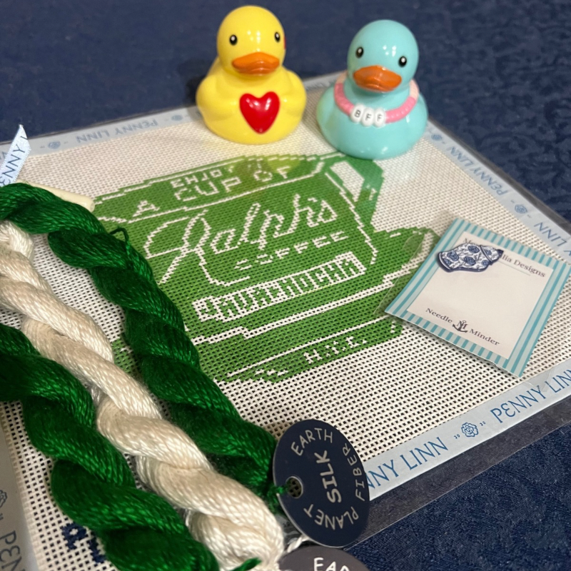 Needlepoint in green and white, two valentine’s ducks