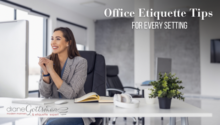 Office etiquette tips | businesswoman smiling at her desk during a zoom call in a modern office setting