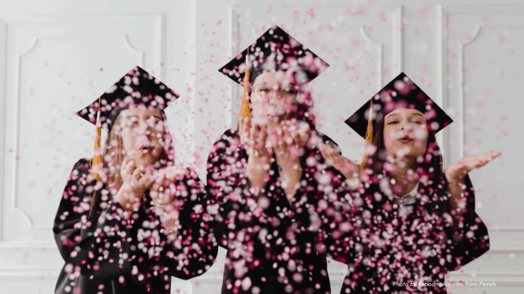 Graduation etiquette for parents | three graduates with caps and confetti, facing camera