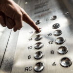 Elevator etiquette | elevator buttons with hand pressing one