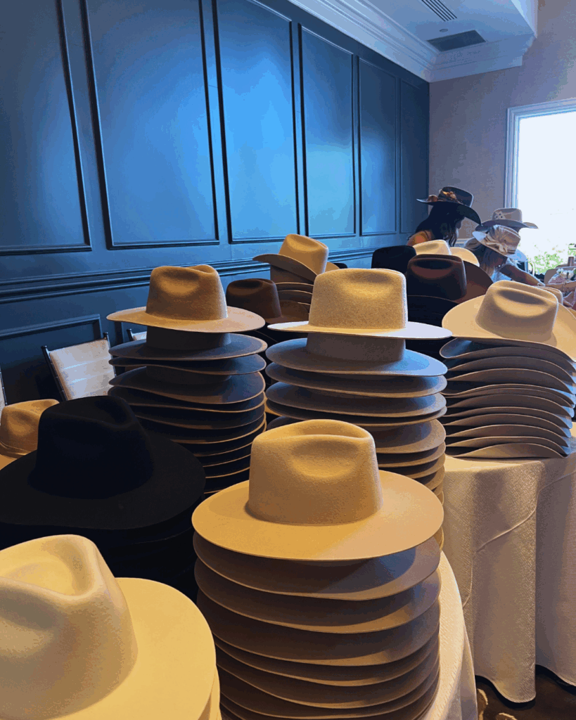 stacks of beautiful felt cowboy hats, ready for ribbons and trim