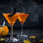 Halloween party etiquette | Halloween pumpkin orange cocktails. Festive drink. Halloween party. Funny Pumpkin with holiday decorations